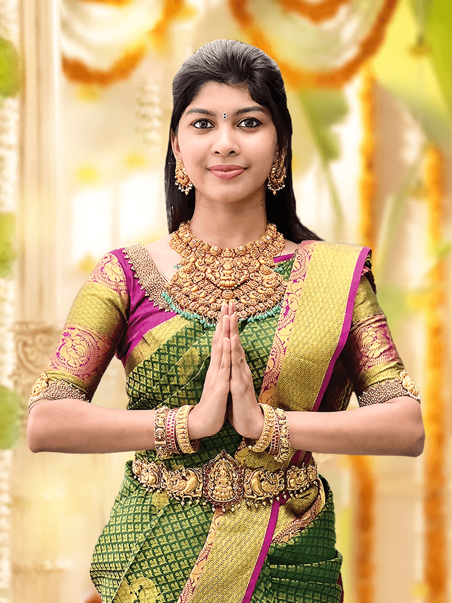 Model wearing layered necklaces